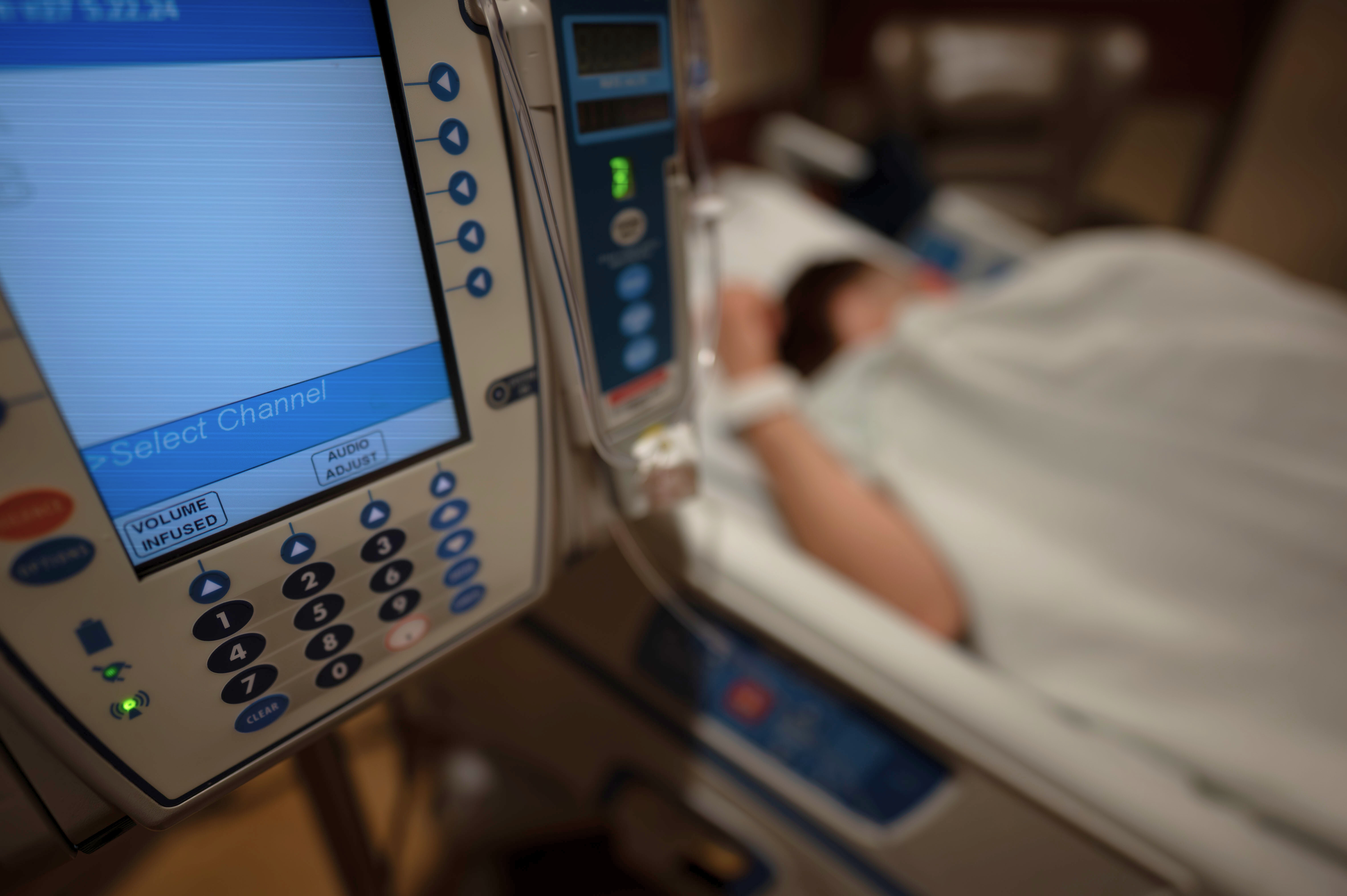 a patient experience trauma lays in their hospital bed