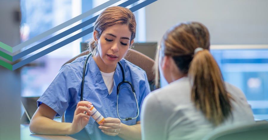 Doctor shows prescription bottle to patient