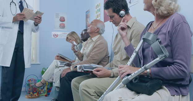 A group of patients participating in a clinical trial wait in a waiting room.