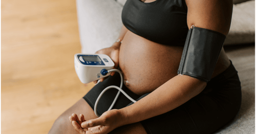 A woman takes her blood pressure postpartum; Health Research Grant Funding from AHW Endowment supports research into postpartum hypertension treatment