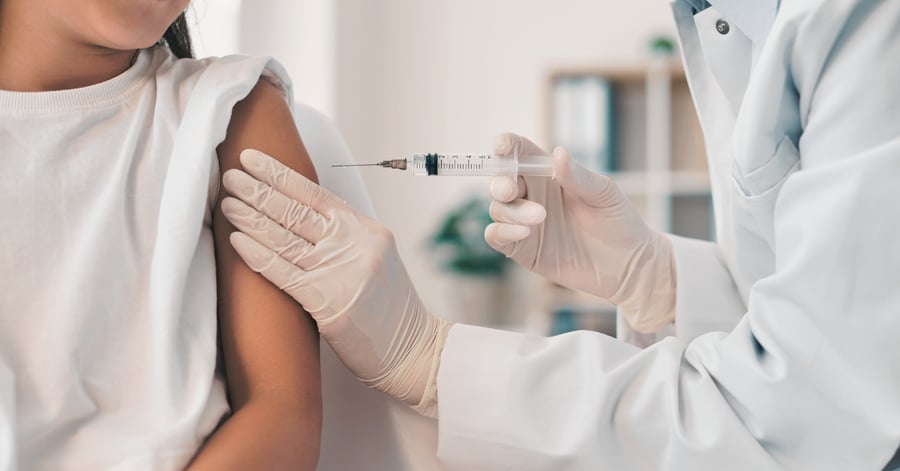A child receives a pediatric vaccine