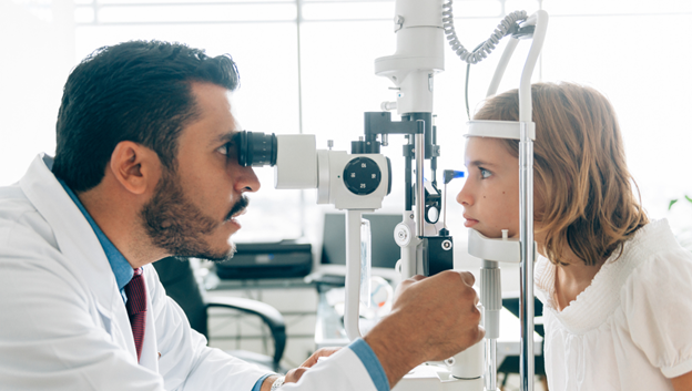 A doctor examines a child's vision. Health research funding from AHW is expanding availability of vision health care for all Wisconsinites.