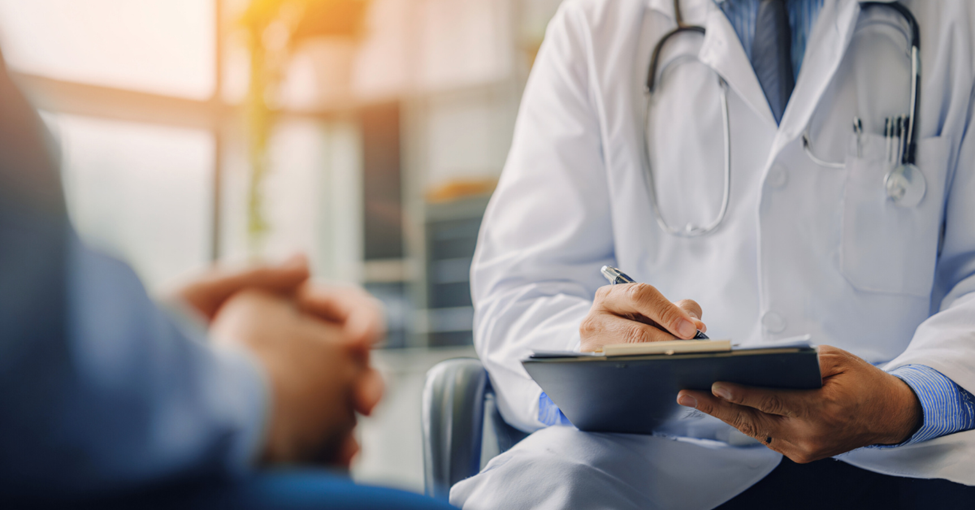 Researchers speak with patients in a clinical trial.